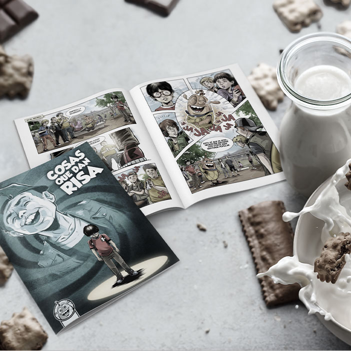 Una mesa con el cómic Cosas que dan risa y cereales Chocoflakes